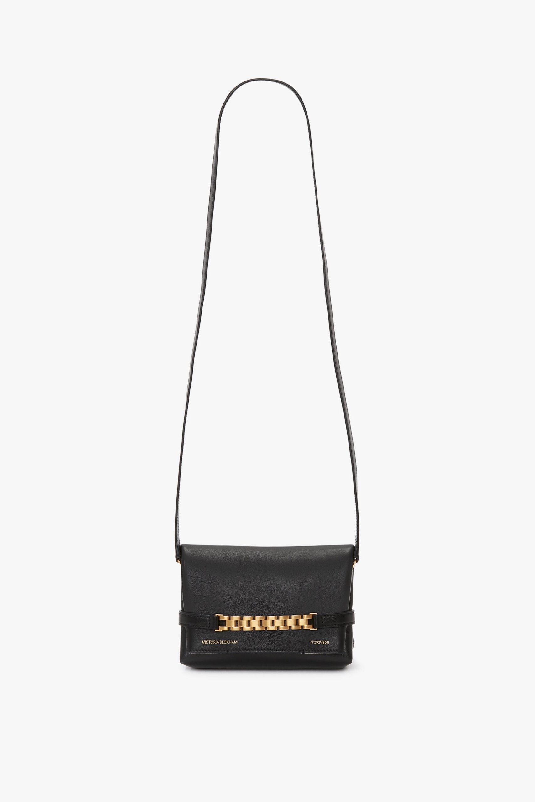 VictoriaBeckham_MiniPouchWithLongStrapInBlackLeather_B423AAC005135B_Front_Model1_1_JPG